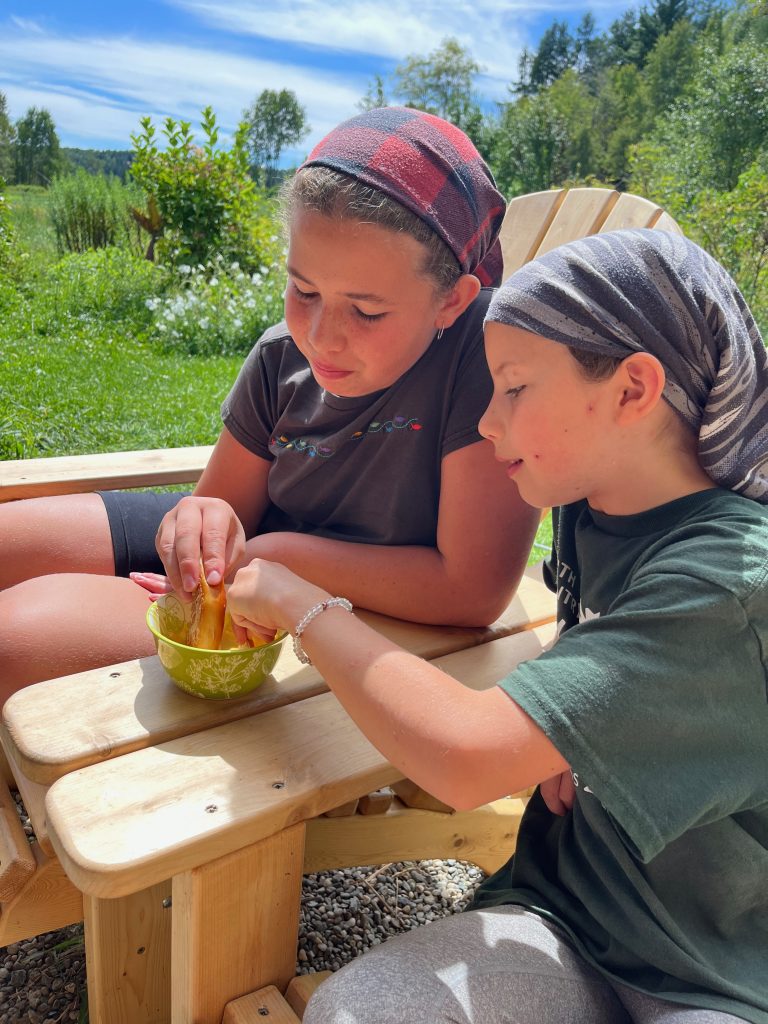 two kids eating pretzels