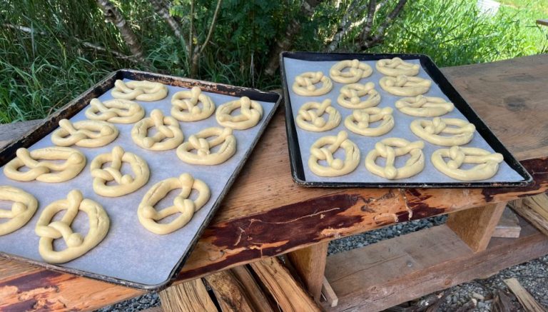 pretzels on baking pans ready to be baked